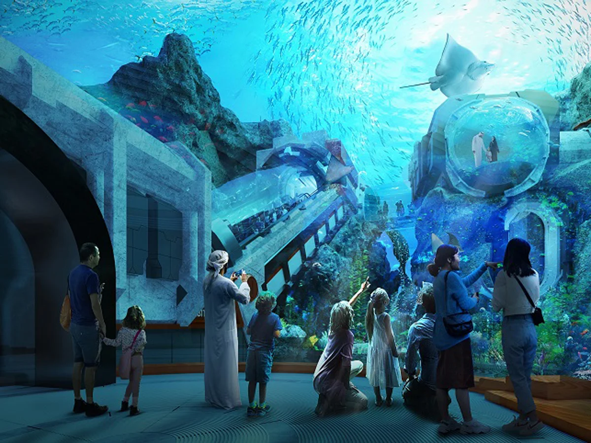 Children participating in a Junior Marine Biologist workshop at SeaWorld Abu Dhabi, examining marine specimens under microscopes with excited expressions